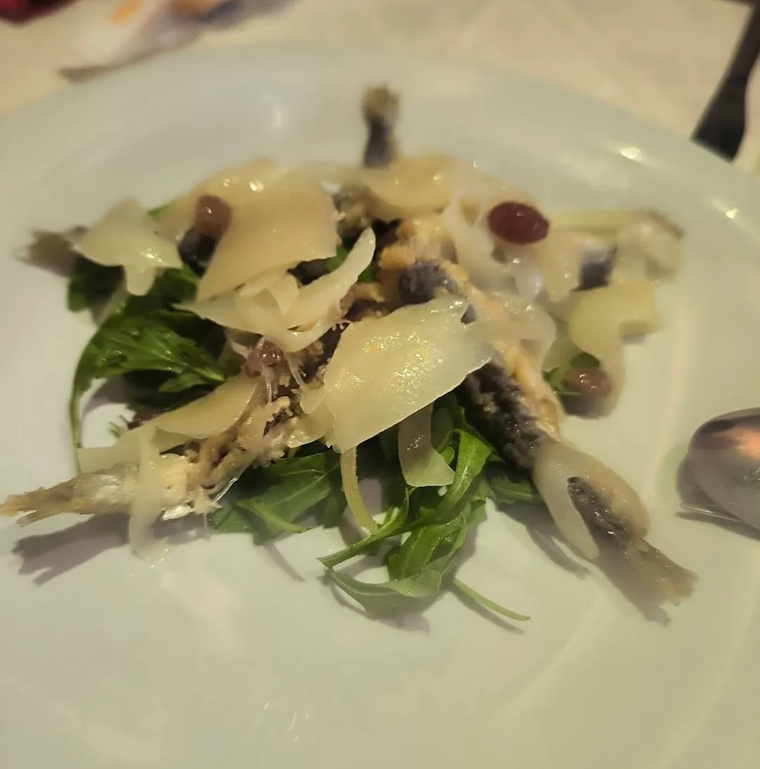 Sarde in saor — sweet-and-sour sardines with onion, raisins and pine nuts